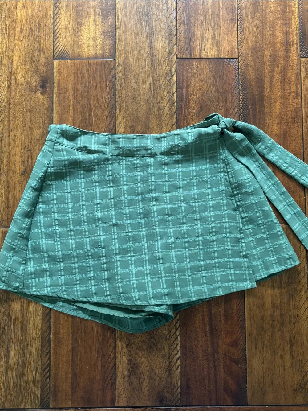 Francesca’s - green, grid-patterned asymmetric wrap skort